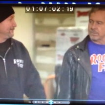 Co-founder Rob and Rowdy Roddy Piper filming a TV show at the Rocket Fizz bottling plant.