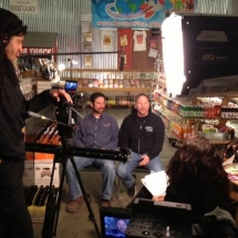 Founders Rob and Ryan filming a TV show at the Rocket Fizz bottling plant.