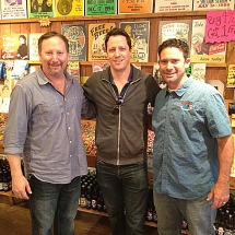 Magician Andrew Mayne standing with Rocket Fizz founders Rob and Ryan.
