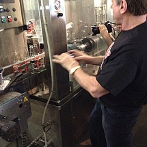 Legendary wrestler and actor Rowdy Roddy Piper is at the Rocket Fizz bottling plant watching his &quot;I&#039;m all out of Bubble Gum&quot; bubble gum soda being bottled.