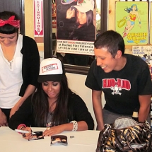 Jersey Shore TV star Snooki signing autographs at Rocket Fizz in California.