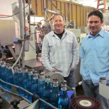 Rocket Fizz founders at the bottling plant.